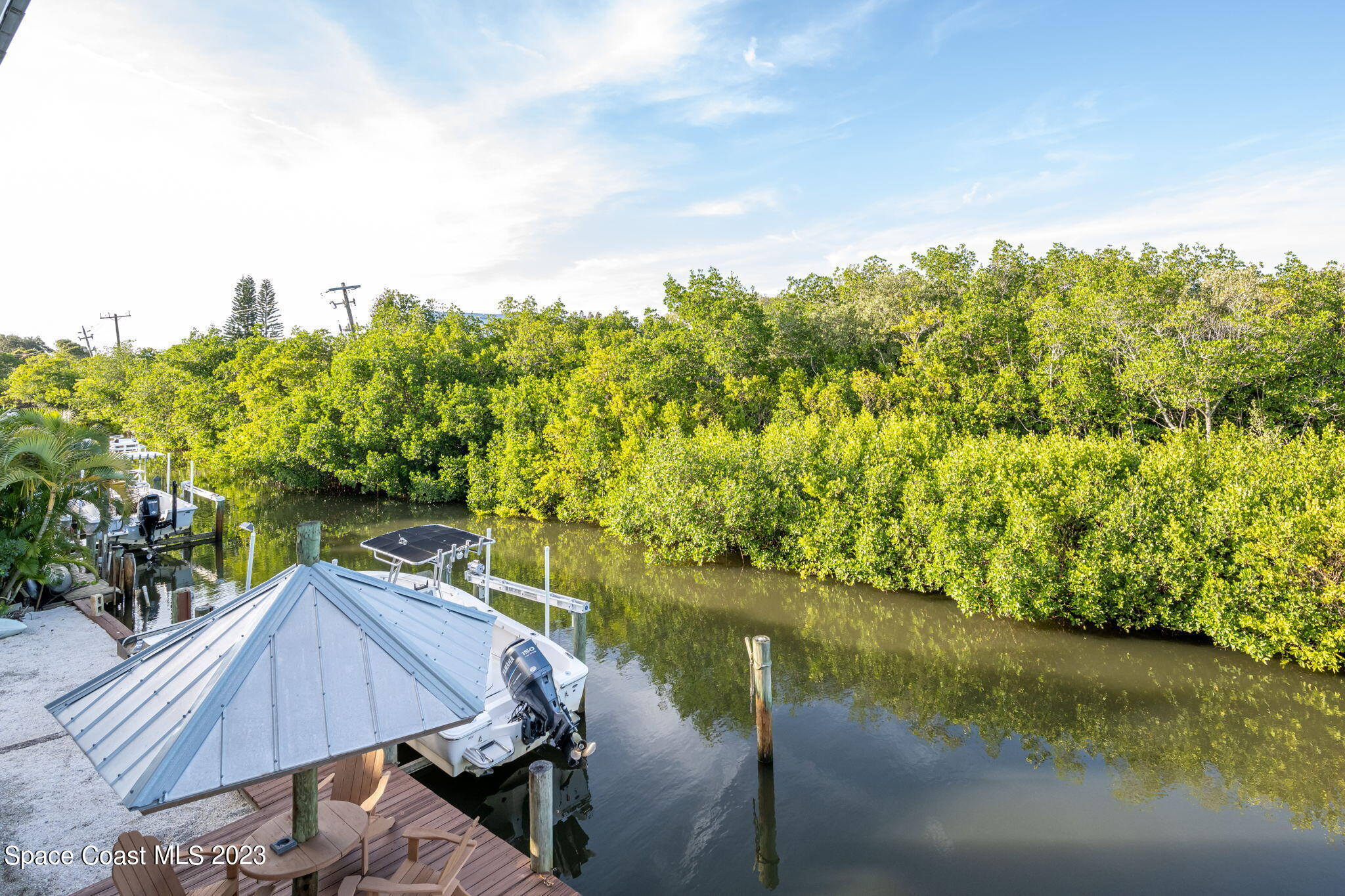 5280 95th Street Sebastian, FL 32958 - Photo 27 of 42 a view of a lake with a house in the background