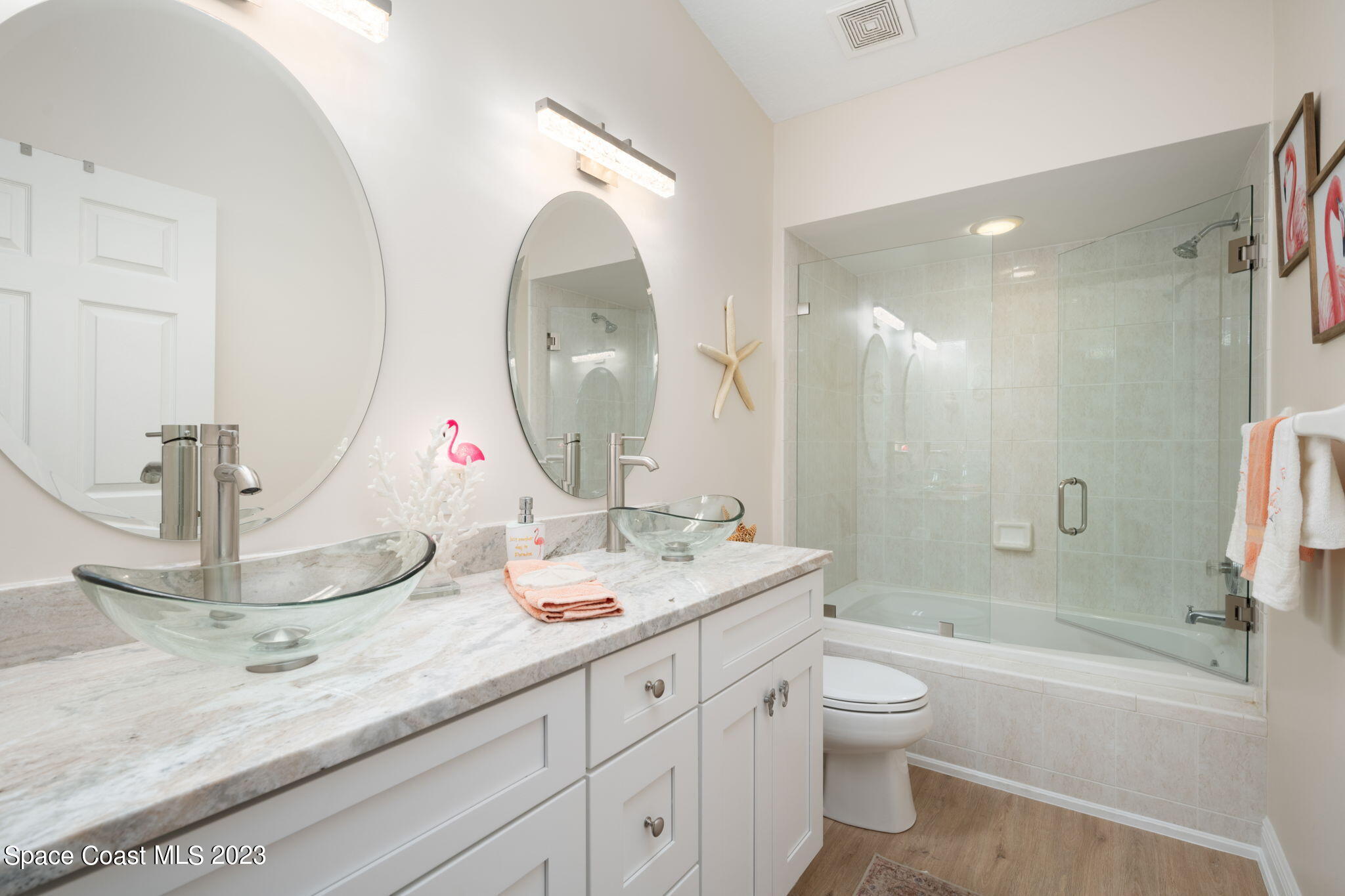 5280 95th Street Sebastian, FL 32958 - Photo 29 of 42 a bathroom with a granite countertop sink mirror vanity and toilet
