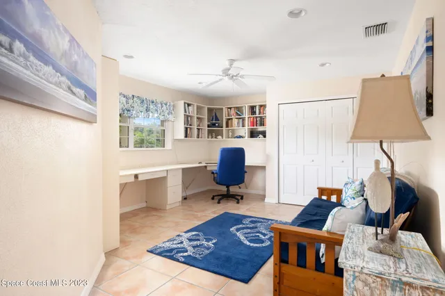 a living room with furniture a rug and a chandelier