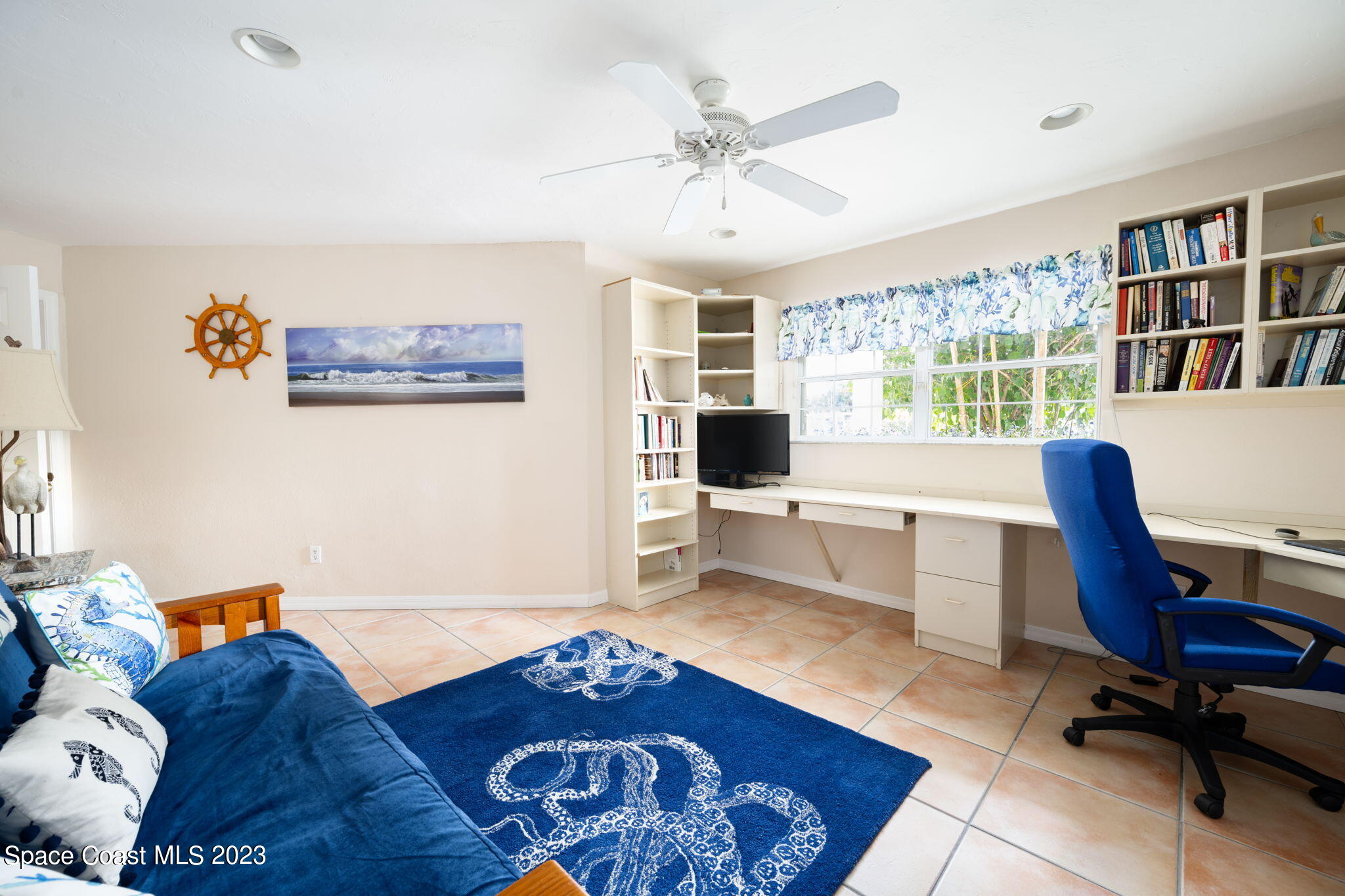 5280 95th Street Sebastian, FL 32958 - Photo 31 of 42 a living room with furniture and a large window