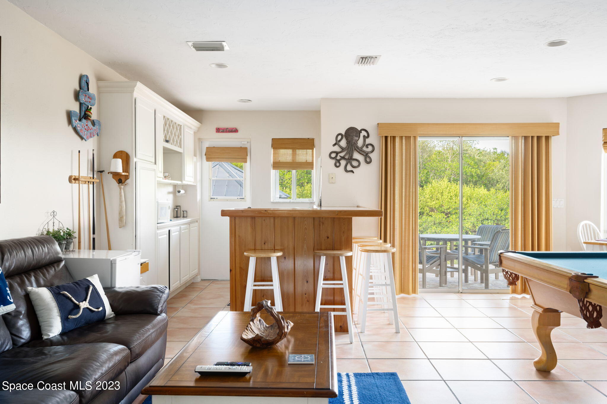 5280 95th Street Sebastian, FL 32958 - Photo 36 of 42 a living room with furniture and a window