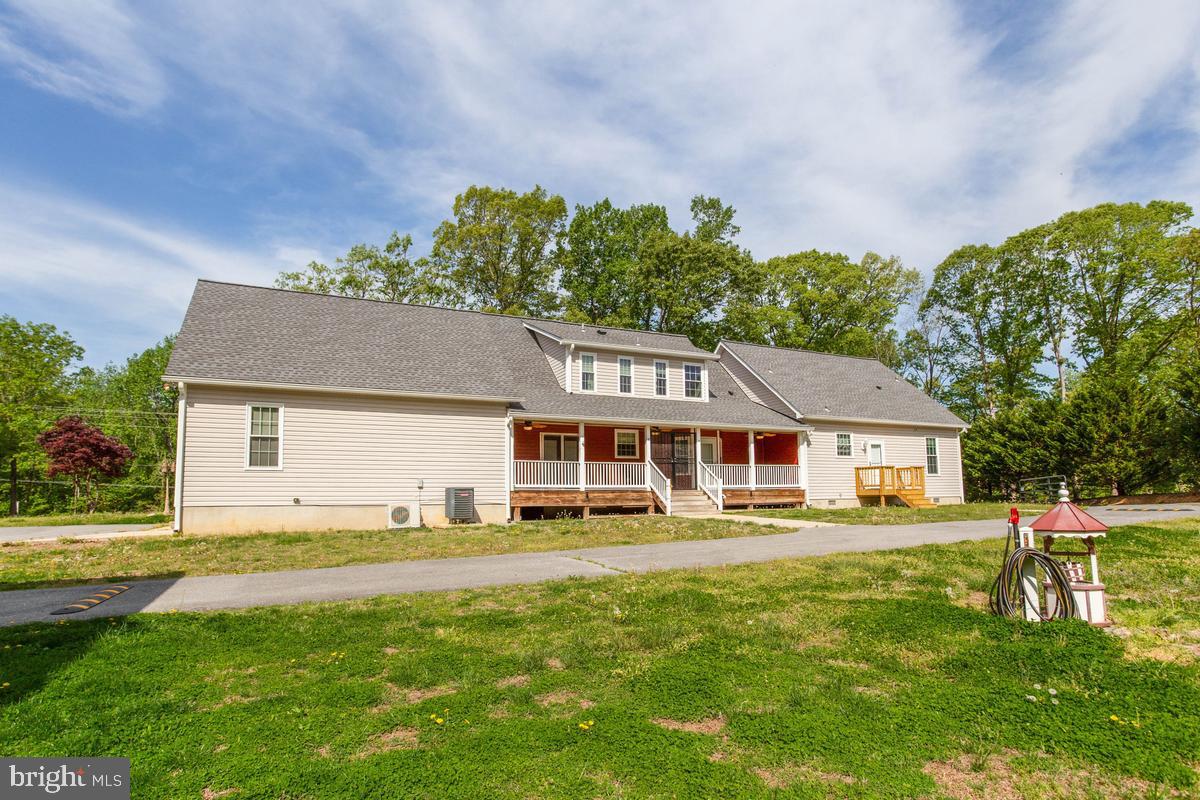 400 Adelina Road Prince Frederick, MD 20678 - Photo 9 of 57 Charming home with lush green surroundings.