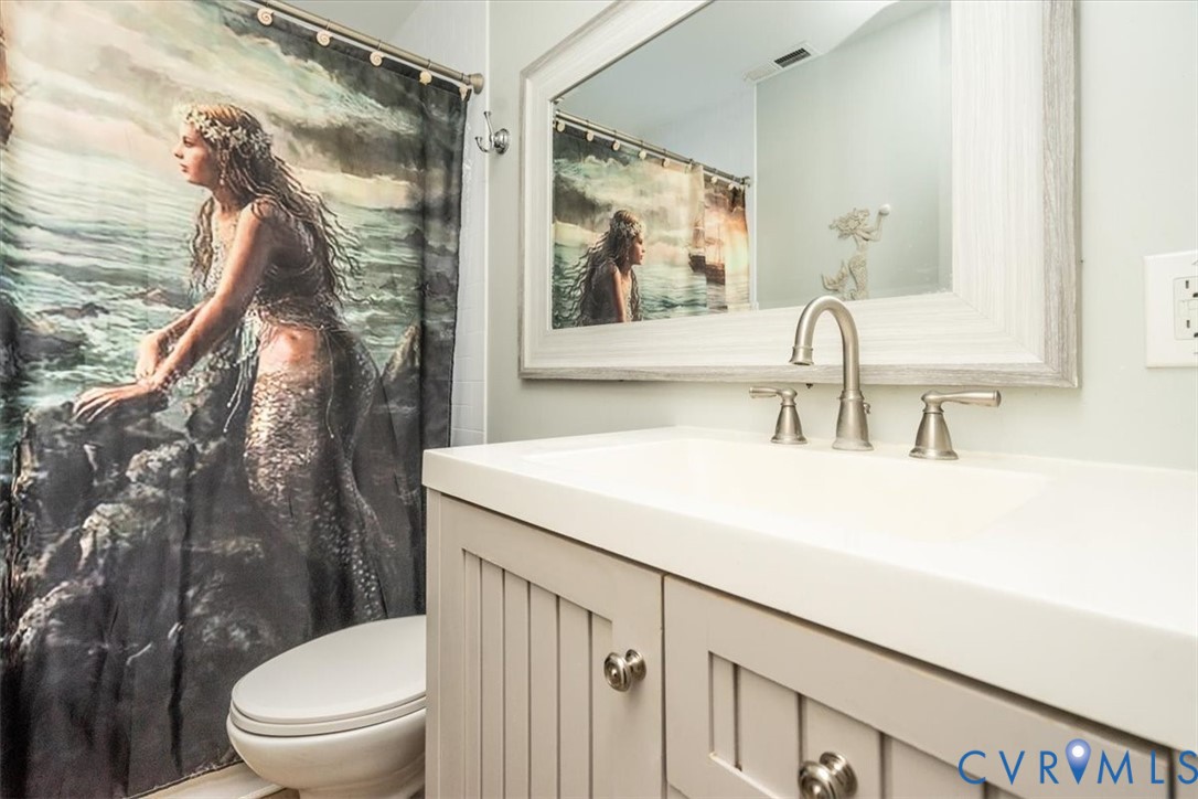 611 Jones Point Beach Road Laneview, VA 22504 - Photo 20 of 27 a bathroom with a sink a toilet and shower