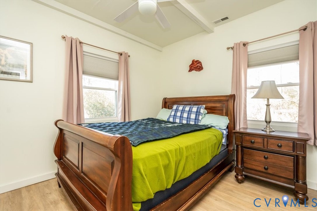 611 Jones Point Beach Road Laneview, VA 22504 - Photo 21 of 27 a bedroom with a bed and window