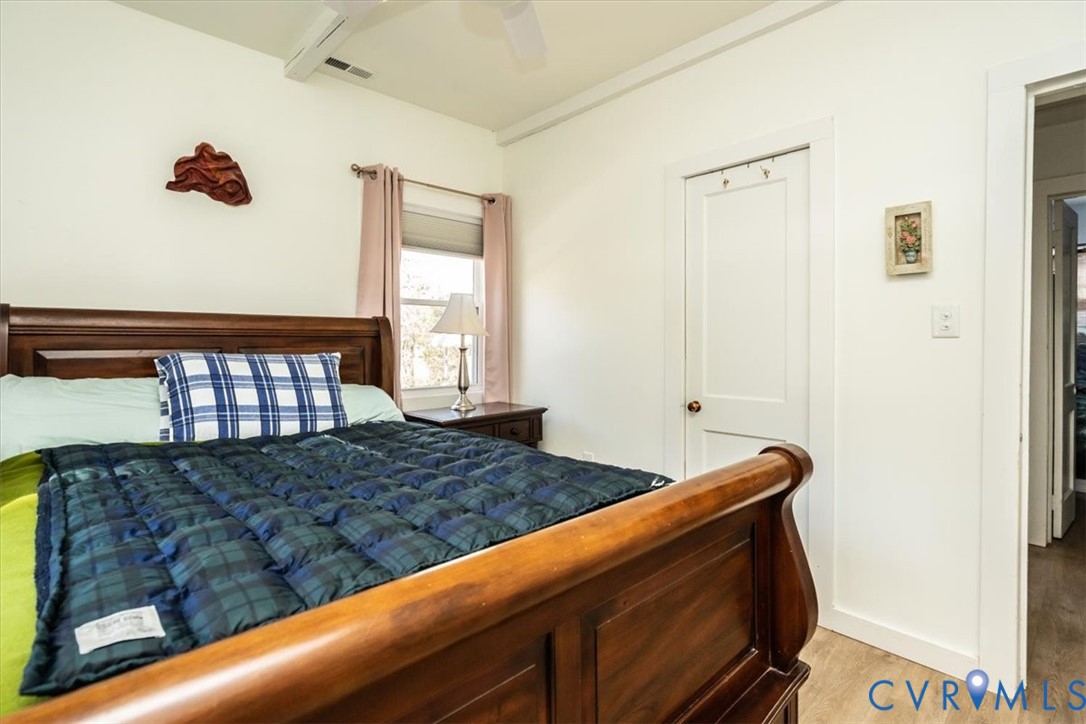 611 Jones Point Beach Road Laneview, VA 22504 - Photo 22 of 27 a bedroom with a bed and a window