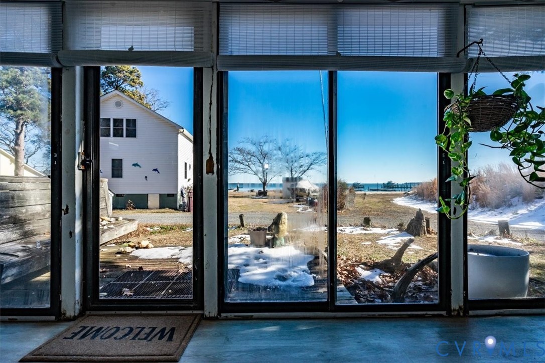 611 Jones Point Beach Road Laneview, VA 22504 - Photo 6 of 27 a view of a living room with furniture and a floor to ceiling window