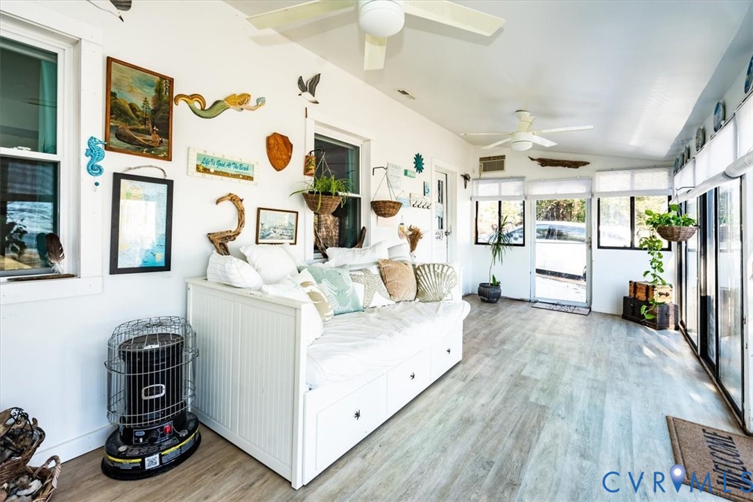 611 Jones Point Beach Road Laneview, VA 22504 - Photo 10 of 27 a living room with furniture and a wooden floor