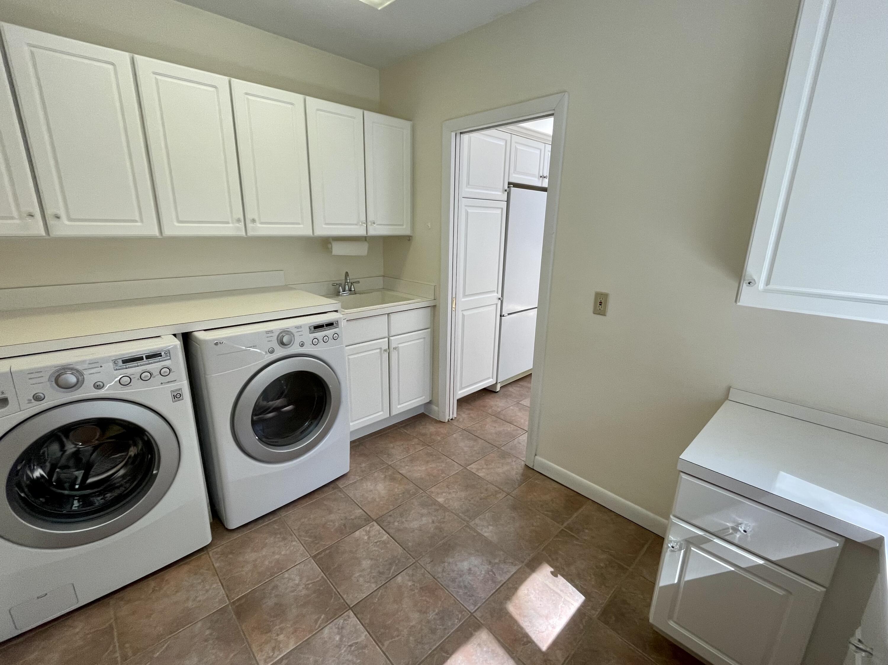 100 Bay Lane Centerville, MA 02632 - Photo 11 of 32 a utility room with dryer and washer