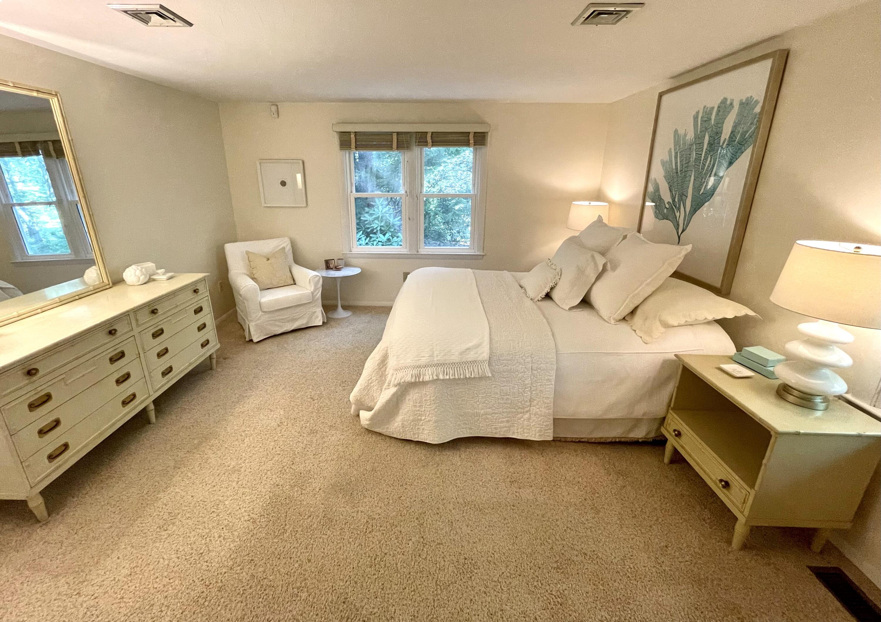 100 Bay Lane Centerville, MA 02632 - Photo 12 of 32 a bedroom with a bed and window