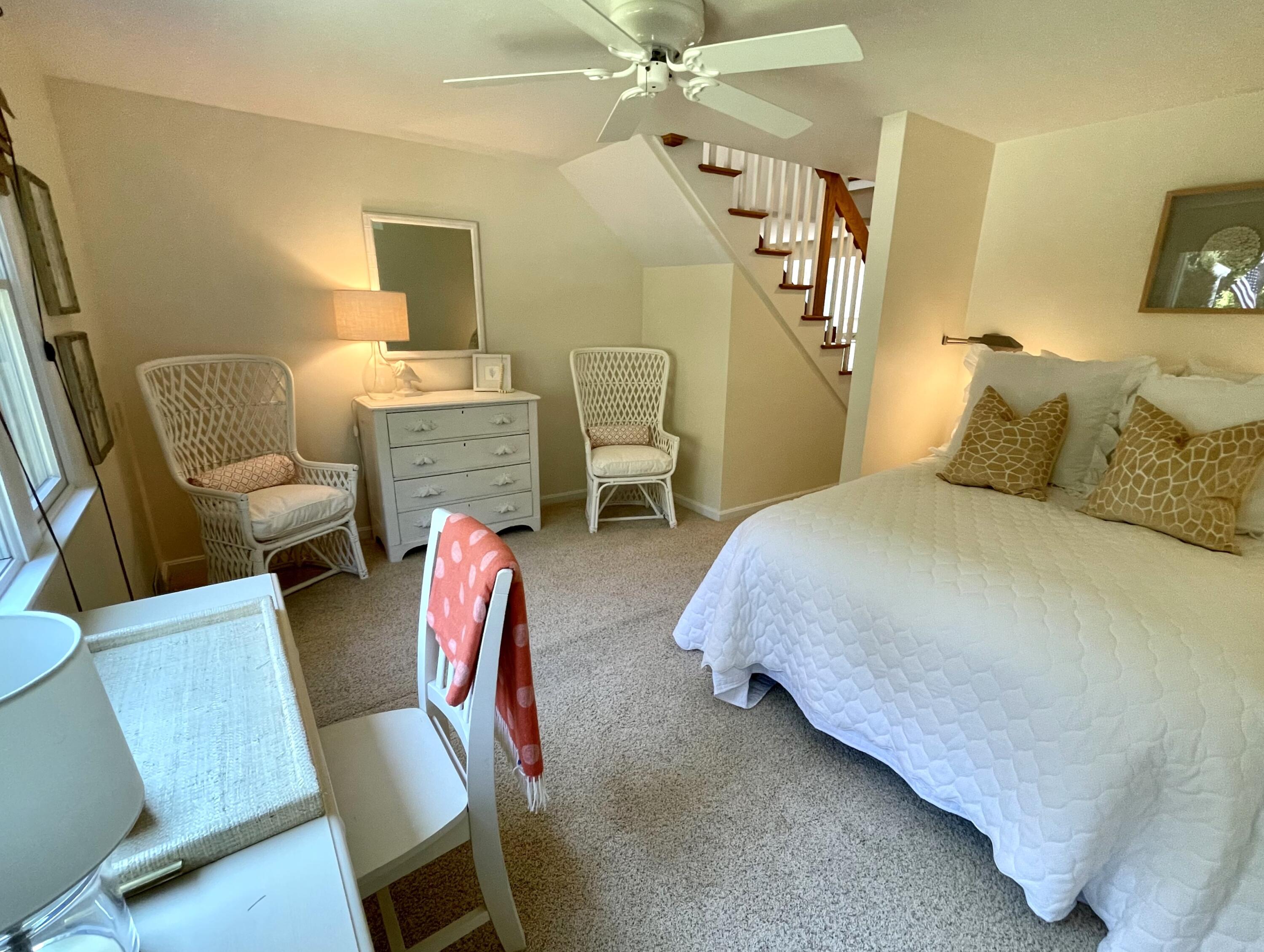 100 Bay Lane Centerville, MA 02632 - Photo 15 of 32 a bedroom with a bed and a chair