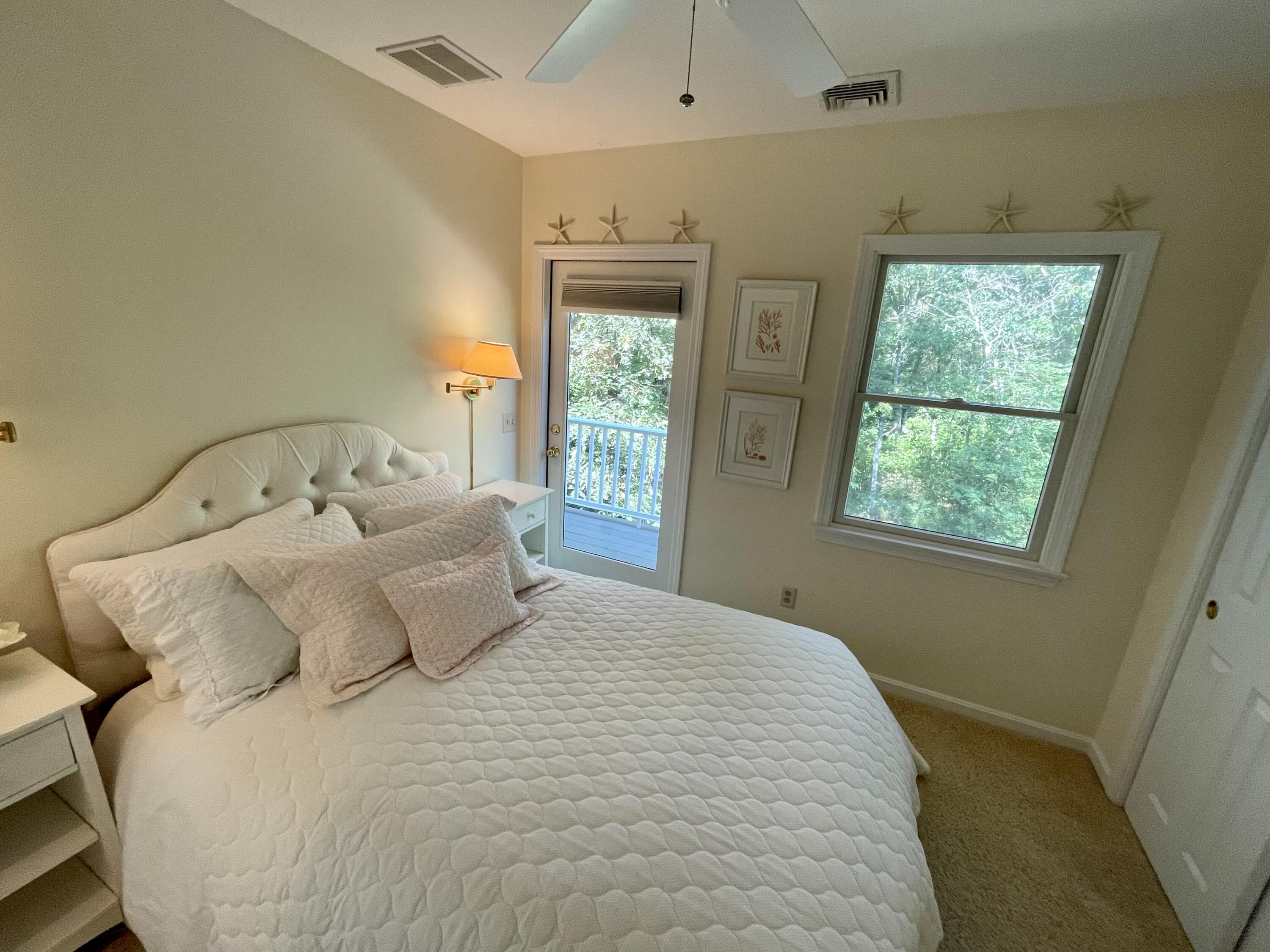100 Bay Lane Centerville, MA 02632 - Photo 16 of 32 a bedroom with a bed and window