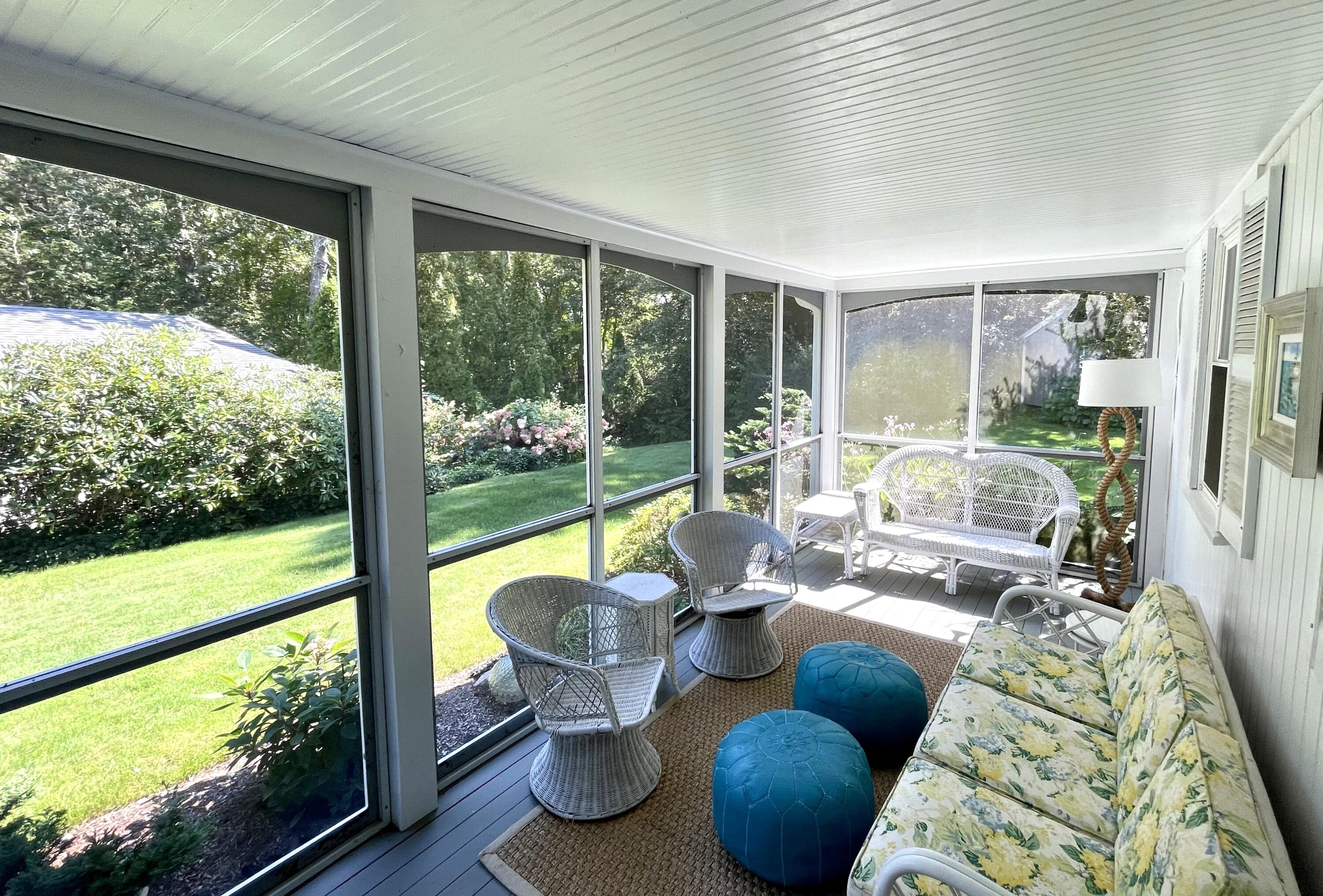 100 Bay Lane Centerville, MA 02632 - Photo 21 of 32 a living room with furniture and a floor to ceiling window