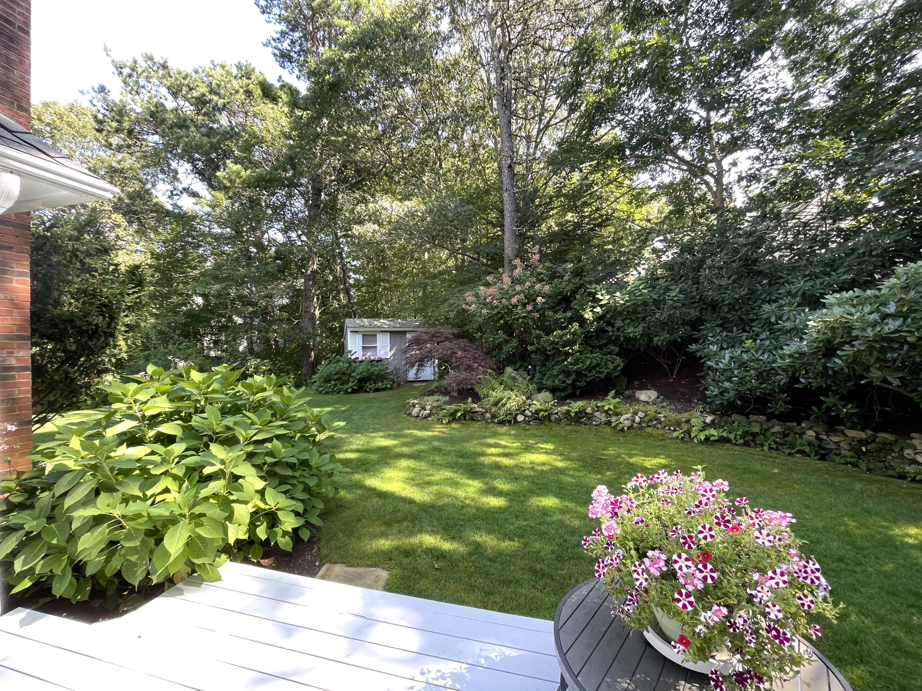 100 Bay Lane Centerville, MA 02632 - Photo 24 of 32 a garden with flowers and trees