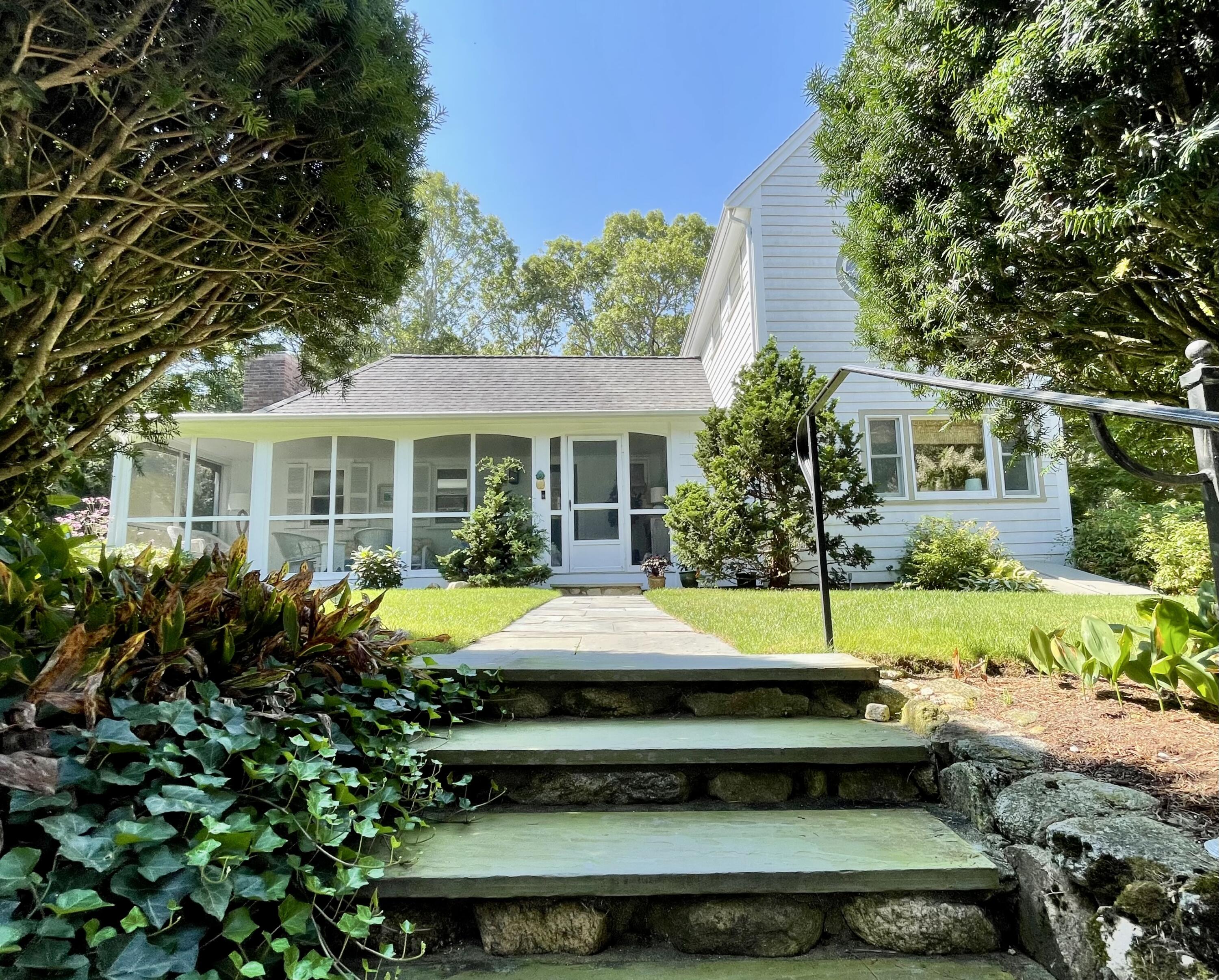 100 Bay Lane Centerville, MA 02632 - Photo 3 of 32 a small pool sitting in front of a house
