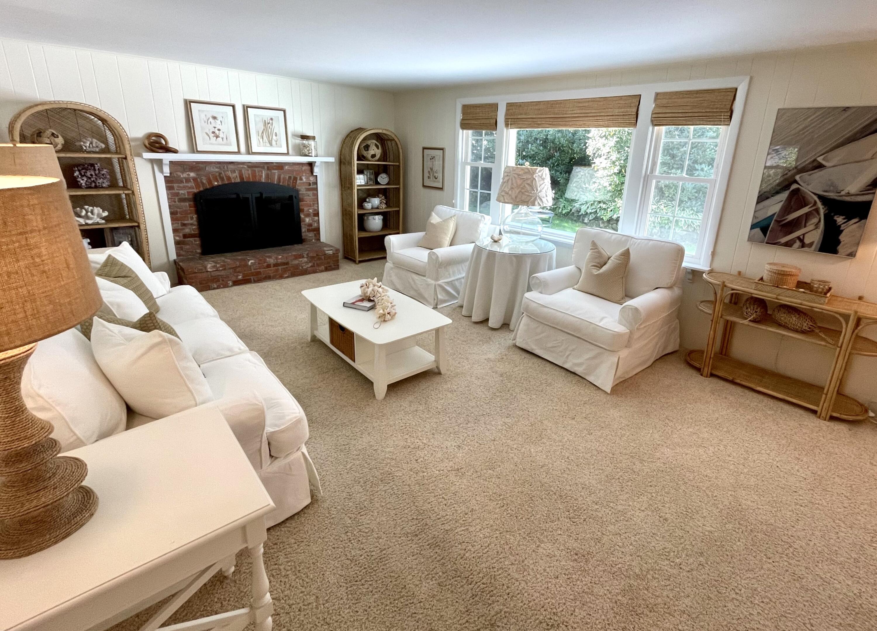 100 Bay Lane Centerville, MA 02632 - Photo 5 of 32 a living room with fireplace furniture and a flat screen tv