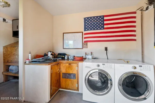 a utility room with dryer and washer