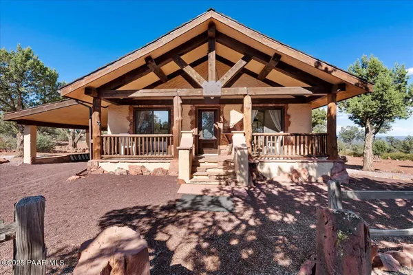 a front view of a house with a porch
