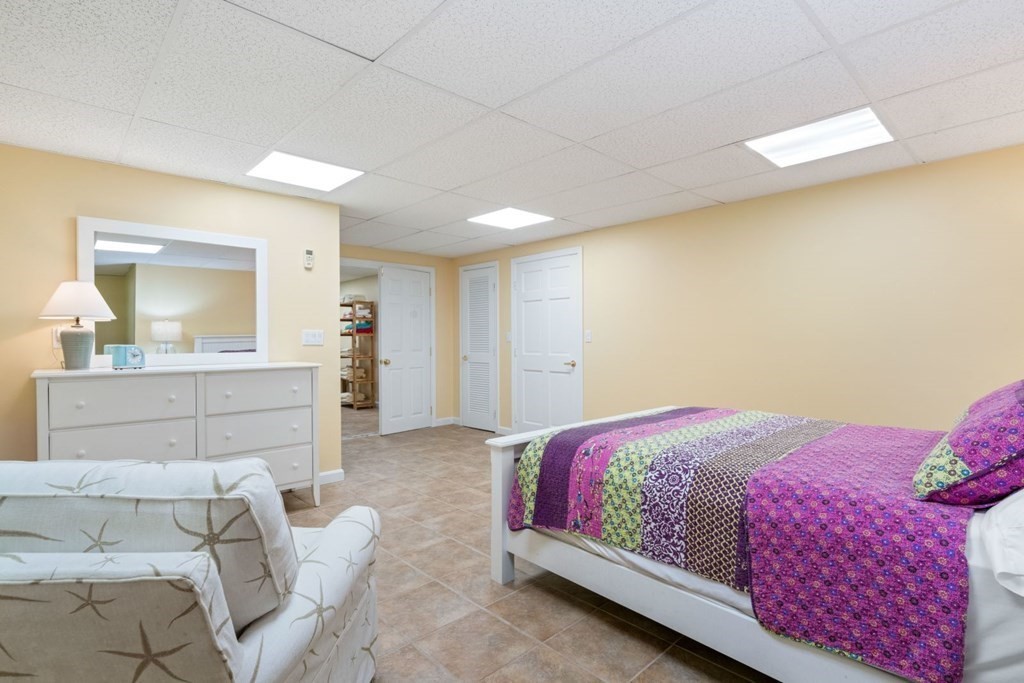 3 Nairn Road Bourne, MA 02559 - Photo 32 of 42 a bedroom with a bed and a mirror