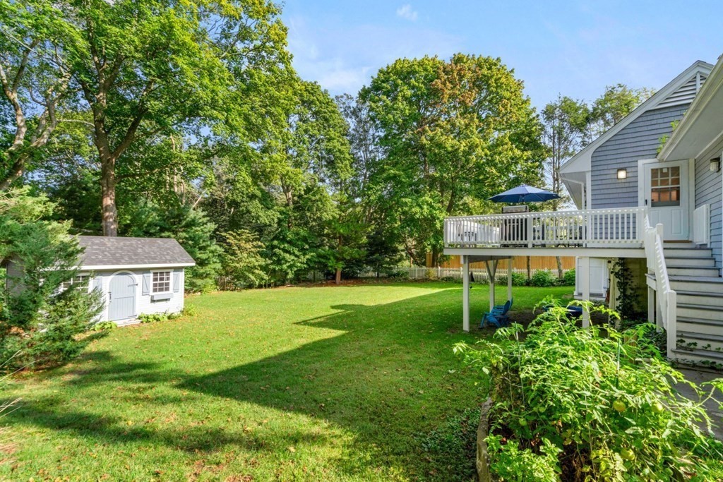 3 Nairn Road Bourne, MA 02559 - Photo 36 of 42 a yellow and red house with a garden