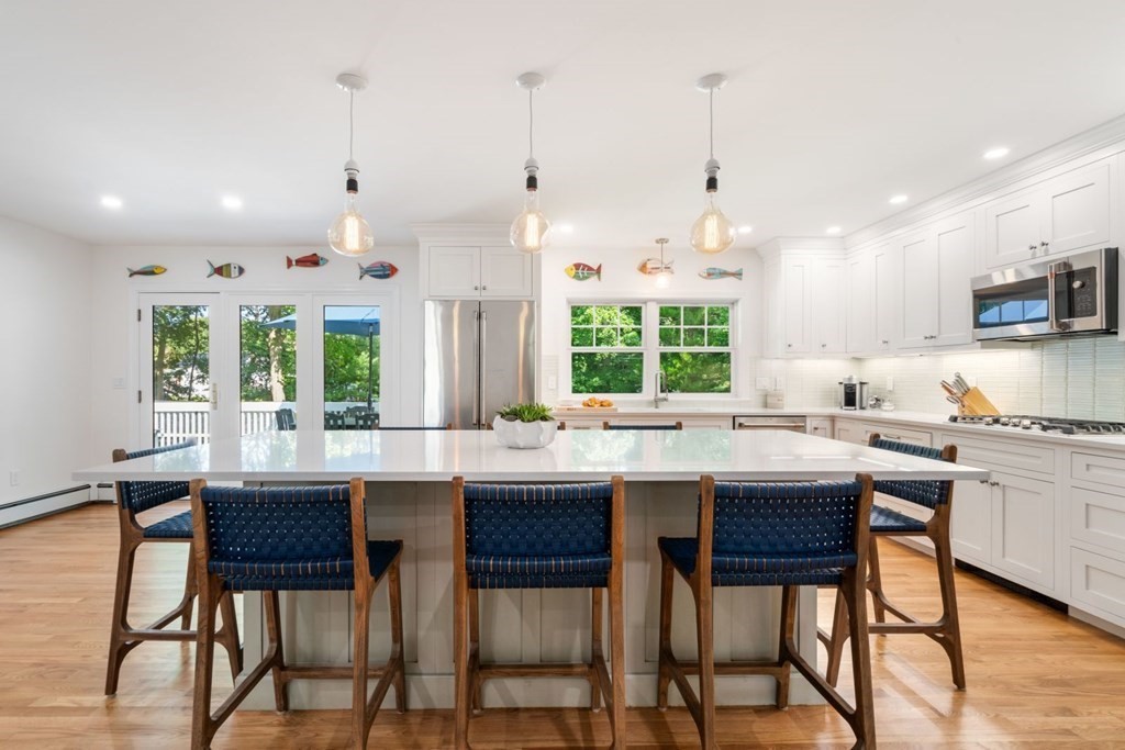 3 Nairn Road Bourne, MA 02559 - Photo 5 of 42 a kitchen with a table chairs stove and cabinets