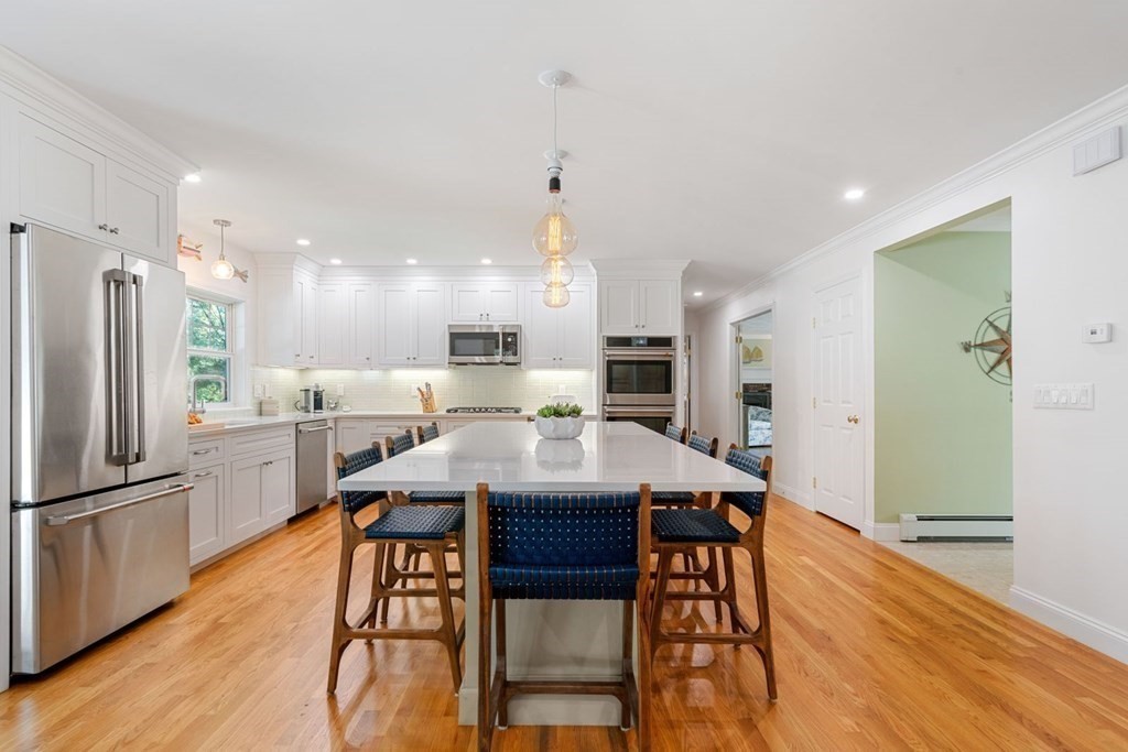 3 Nairn Road Bourne, MA 02559 - Photo 10 of 42 a large kitchen with a table and chairs