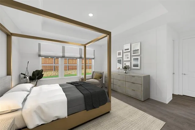 a spacious bedroom with a bed and a dresser