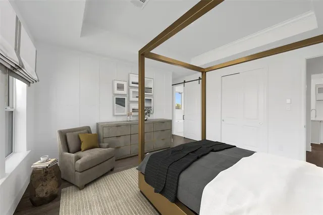 a bedroom with a bed and a couch