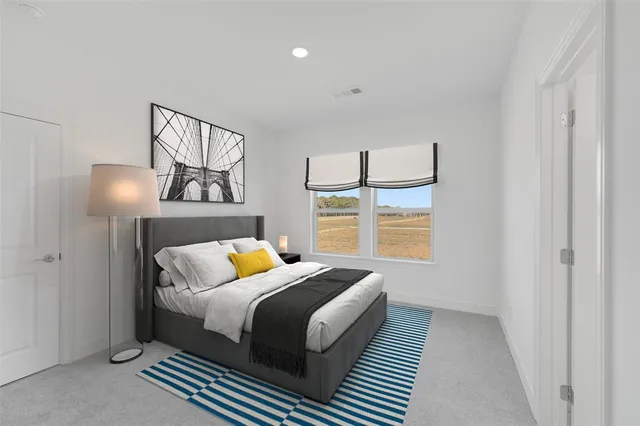 a bedroom with furniture and a window