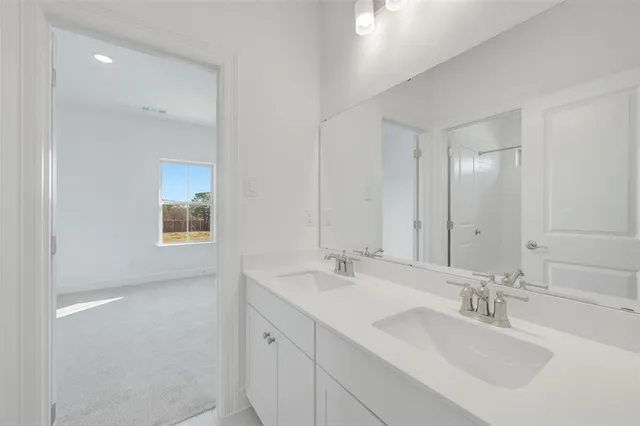 a bedroom with a bed and a night stand