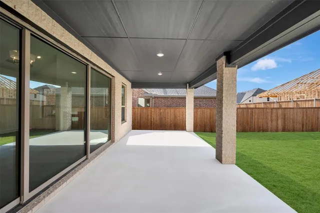 a view of an entryway of house with backyard