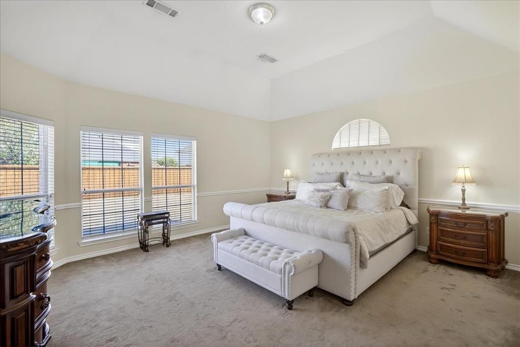 7308 Hawk Lane Sachse, TX 75048 - Photo 16 of 37 a bedroom with bed and a large window