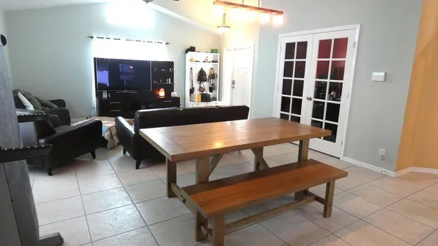 a view of a workspace room with furniture