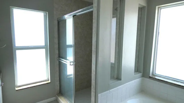 a view of a hallway with wooden shelves