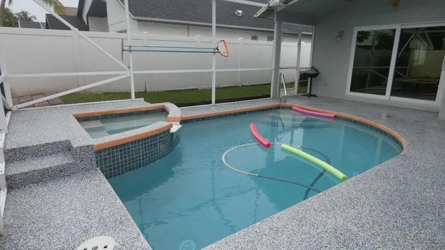 a backyard of a house with a basket ball court