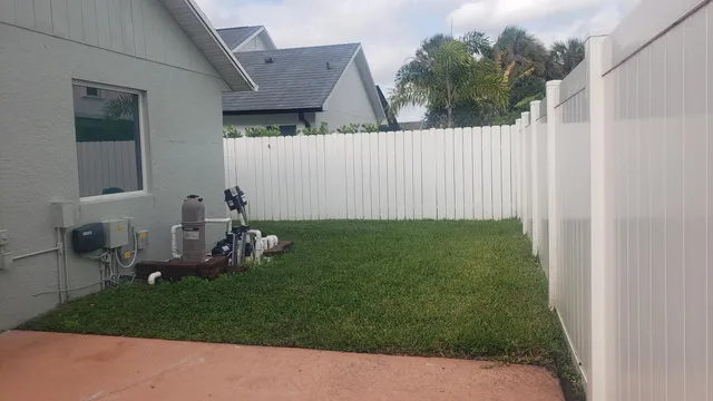 a view of a backyard with seating area