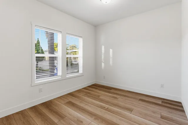 a bathroom with a sink toilet a mirror and shower