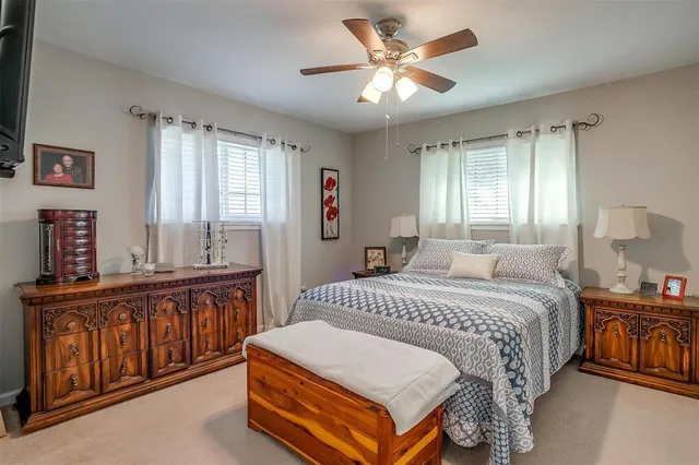 a spacious bedroom with a bed and window