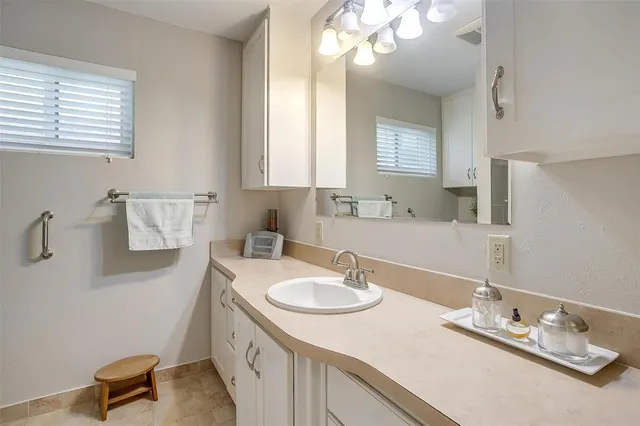 a bathroom with a sink double vanity and a mirror