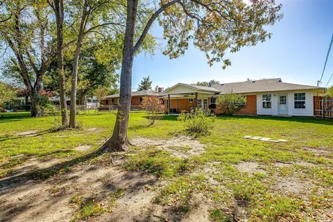 a view of a house with a big yard