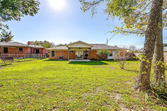 a front view of house with garden