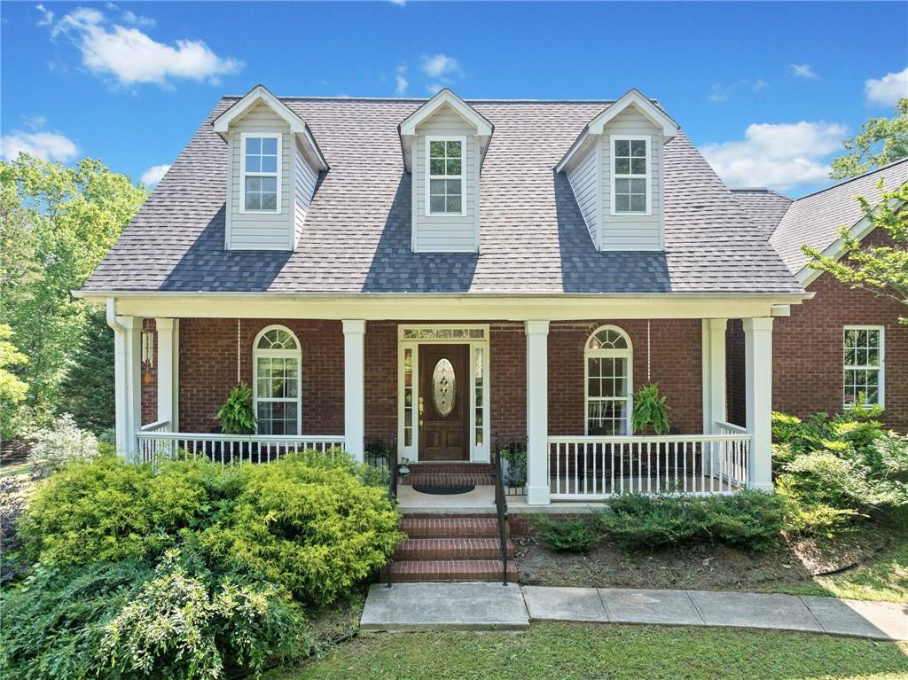 675 Jack Page Lane Canton, GA 30115 - Photo 1 of 1 a view of a brick house with large windows and a yard