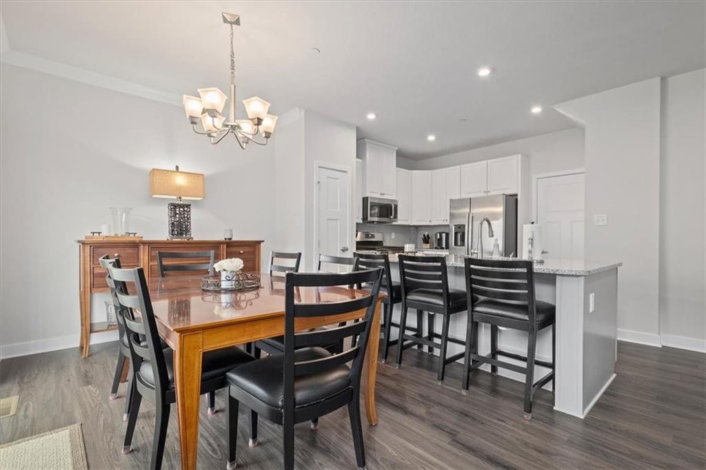 232 Cranesbill Drive Mars, PA 16046 - Photo 11 of 25 a view of a dining room with furniture and wooden floor