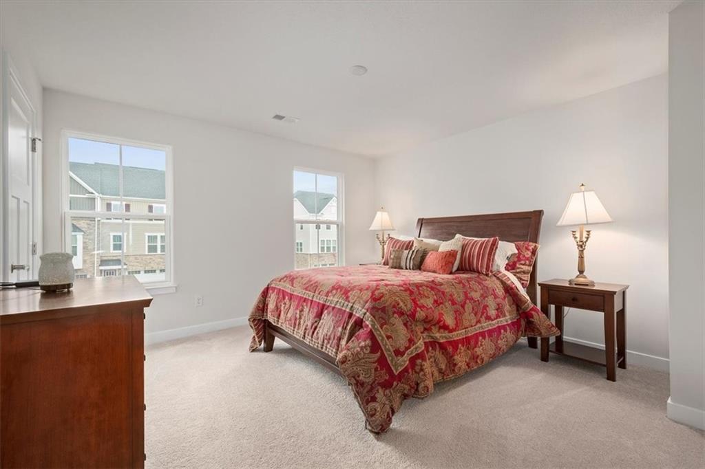 232 Cranesbill Drive Mars, PA 16046 - Photo 13 of 25 a bedroom with a bed and a table