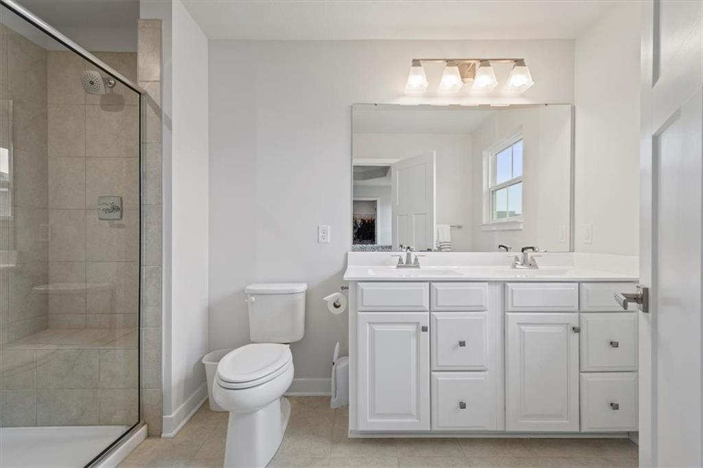 232 Cranesbill Drive Mars, PA 16046 - Photo 19 of 25 a bathroom with a double vanity sink mirror and toilet