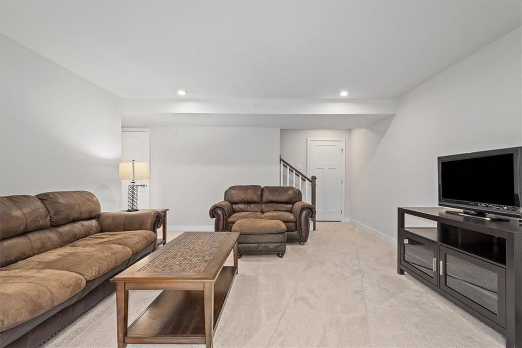 232 Cranesbill Drive Mars, PA 16046 - Photo 22 of 25 a living room with furniture and a flat screen tv