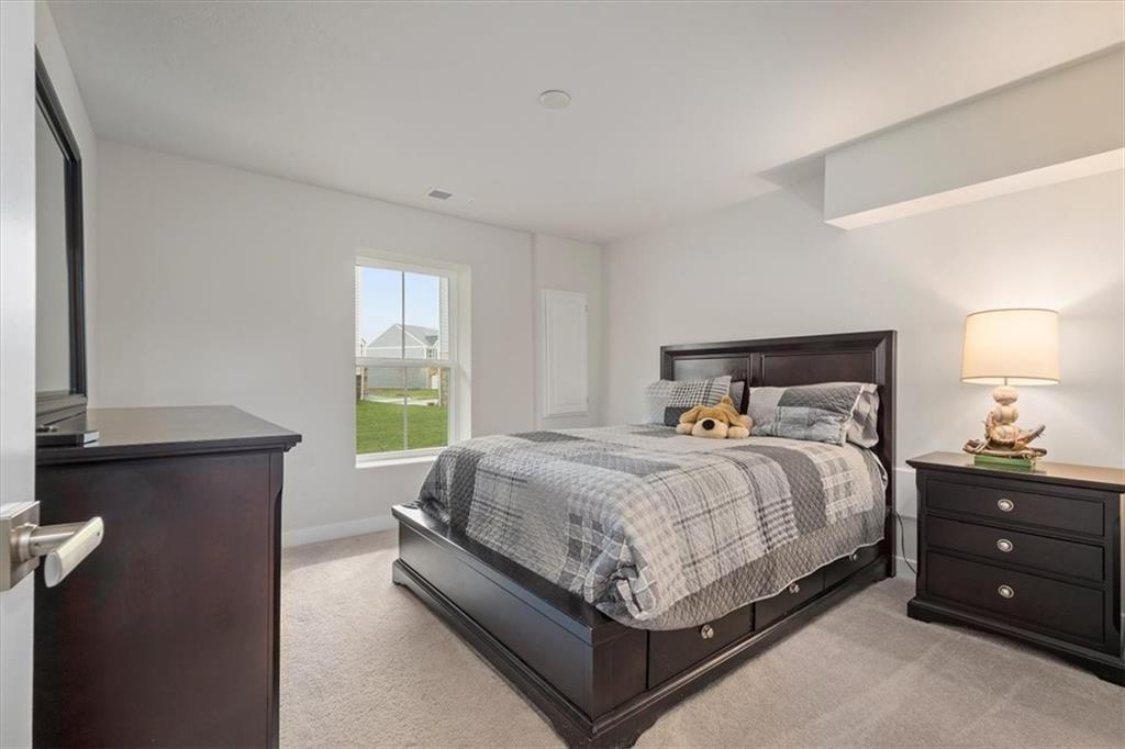 232 Cranesbill Drive Mars, PA 16046 - Photo 23 of 25 a bedroom with a bed and window
