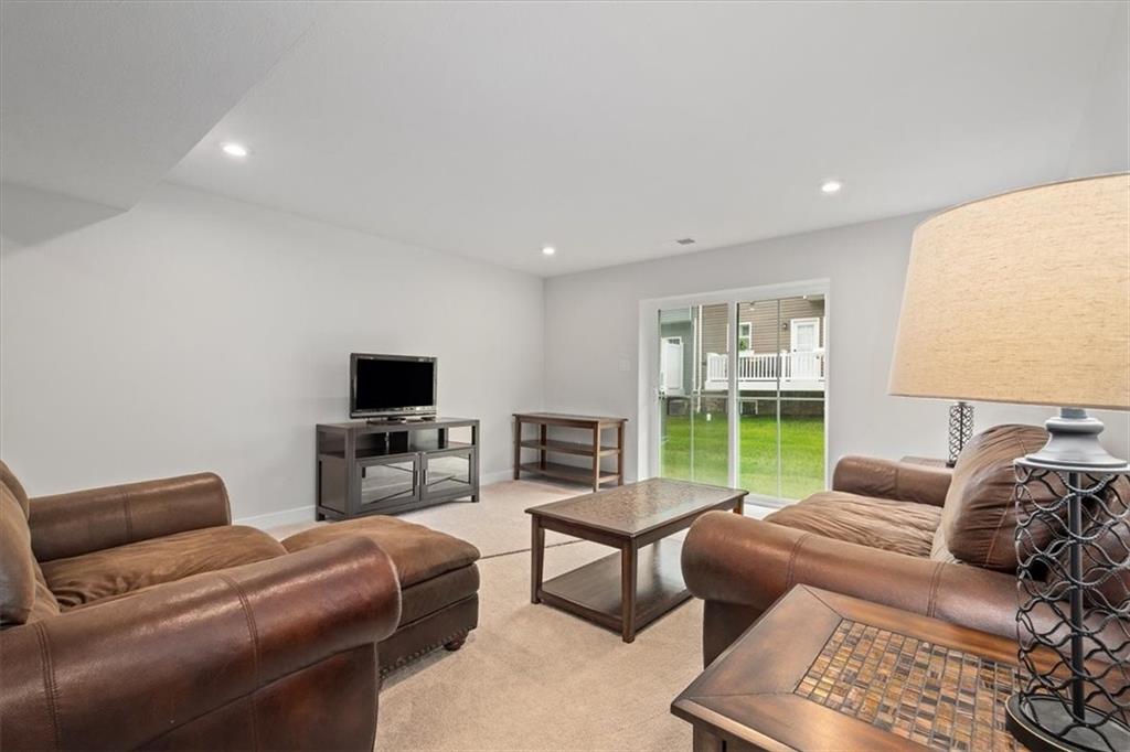 232 Cranesbill Drive Mars, PA 16046 - Photo 25 of 25 a living room with furniture and a flat screen tv