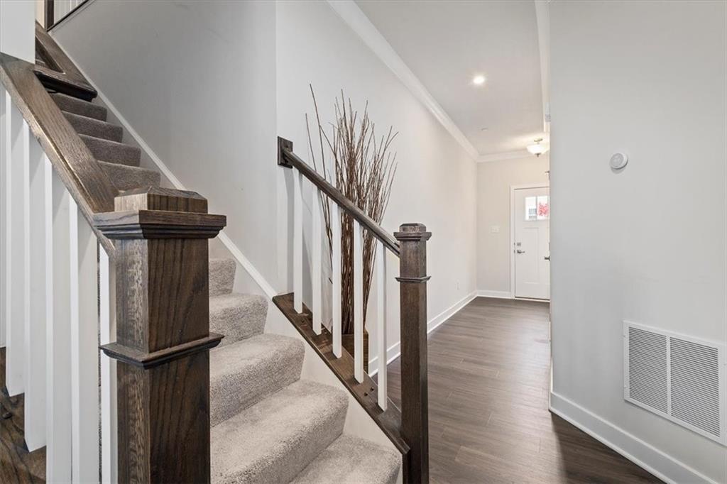 232 Cranesbill Drive Mars, PA 16046 - Photo 4 of 25 a view of hallway with stairs and wooden floor