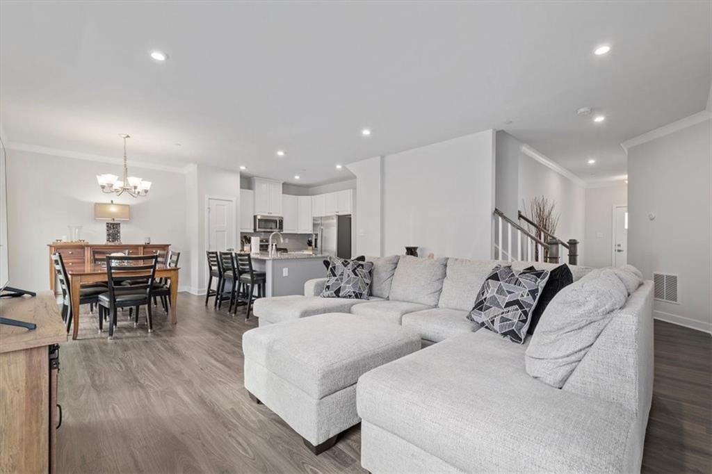 232 Cranesbill Drive Mars, PA 16046 - Photo 5 of 25 a living room with furniture a table and chairs with wooden floor