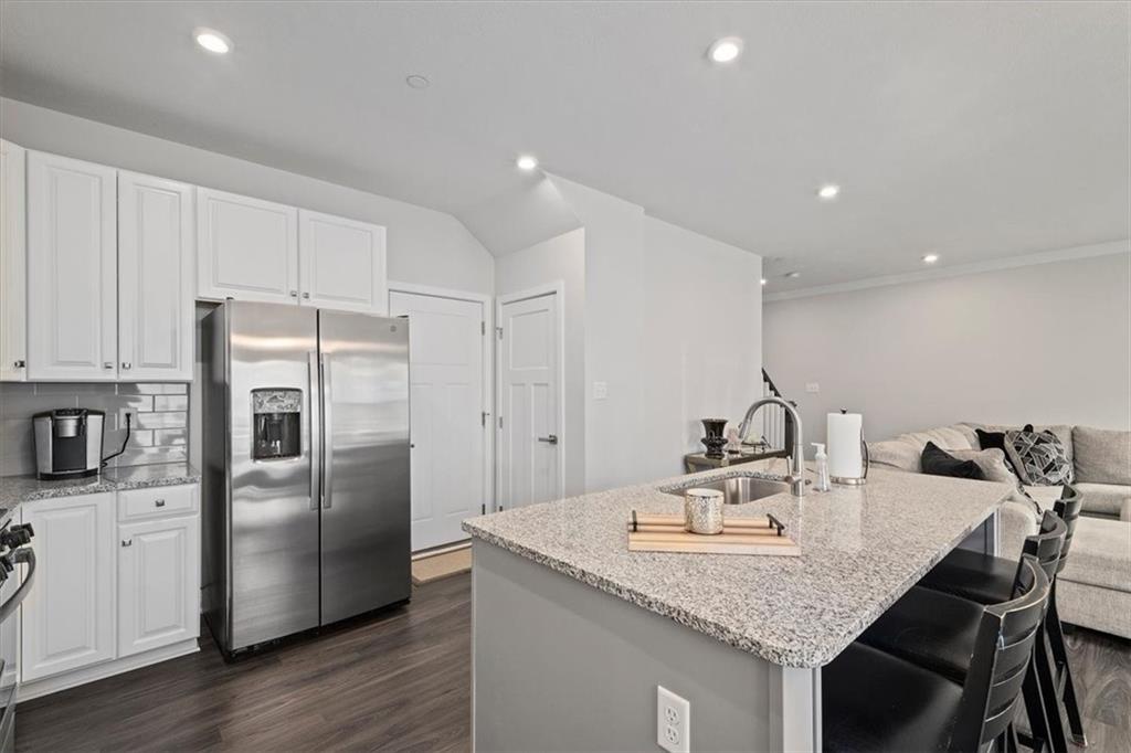 232 Cranesbill Drive Mars, PA 16046 - Photo 9 of 25 a kitchen with kitchen island a counter space a sink appliances and cabinets